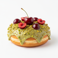 Vegan Pistachio Cherry Bliss donut on a clean white background